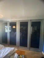 TaylorMade shaker sliding wardrobe with anthracite glass, fitted in West Rounton